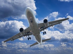 plane-with-clouds---shutterstock_147206183